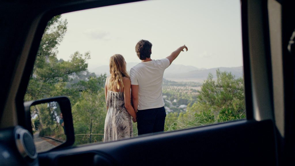 Romantic date in open SUV. Couple on a viewpoint